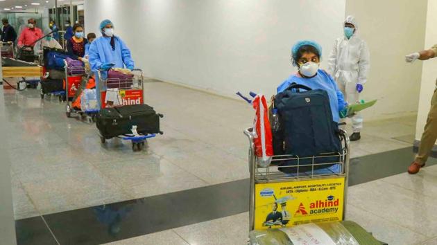 Passengers arrive from Kuwait by an Air India flight at Calicut International Airport during the Covid-19 pandemic in Kozhikode on May 14, 2020.(PTI File Photo) Passengers arrive from Kuwait by an Air India flight at Calicut International Airport during the Covid-19 pandemic in Kozhikode on May 14, 2020.(PTI File Photo)