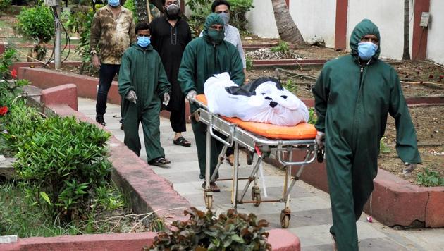 The body of a woman who died of Covid-19 in Mumbai being taken for burial. (ANI) The body of a woman who died of Covid-19 in Mumbai being taken for burial. (ANI)