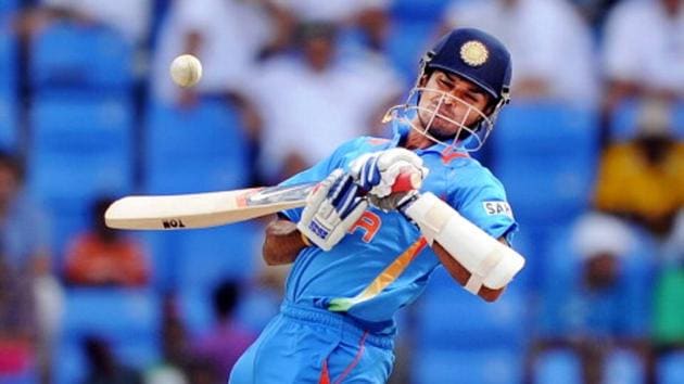 Indian cricketer Subramaniam Badrinath leaps in the air to avoid a bouncer(AFP via Getty Images)