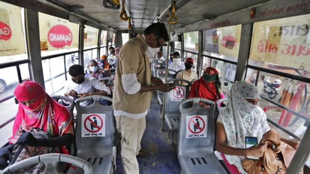 Commuters seen seated inside a bus while maintaining social distance in Ahmedabad. The city is a major contributor of Covid-19 cases in the state tally, accounting for nearly 16,000 cases till date. On June 13, Gujarat’s coronavirus tally jumped to 22,527. The state has seen 1,415 Covid-19 fatalities so far. (Ajit Solanki / AP) Commuters seen seated inside a bus while maintaining social distance in Ahmedabad. The city is a major contributor of Covid-19 cases in the state tally, accounting for nearly 16,000 cases till date. On June 13, Gujarat’s coronavirus tally jumped to 22,527. The state has seen 1,415 Covid-19 fatalities so far. (Ajit Solanki / AP)