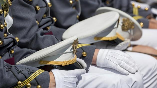 West Point cadets hold their caps on their laps during graduation ceremonies at the United States Military Academy in West Point, New York.(AP) West Point cadets hold their caps on their laps during graduation ceremonies at the United States Military Academy in West Point, New York.(AP)