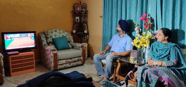 Parents of a newly commissioned officer watching the passing out parade at their Mohali residence on Saturday,(HT Photo) Parents of a newly commissioned officer watching the passing out parade at their Mohali residence on Saturday,(HT Photo)
