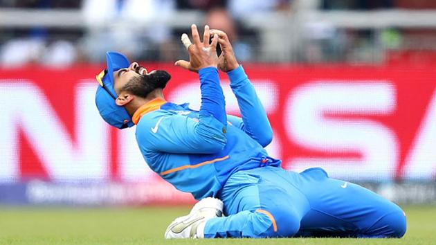 India captain Virat Kohli after dropping a catch. (Getty Images) India captain Virat Kohli after dropping a catch. (Getty Images)