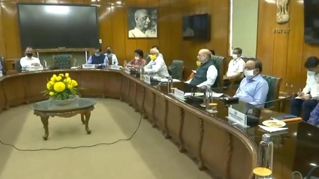 Union home minister Amit Shah and health minister Harsh Vardhan hold a meeting with Lt Gen Anil Baijal and Chief Minister Arvind Kejriwal on Covid-19 situation in Delhi on Sunday., (ANI Photo) Union home minister Amit Shah and health minister Harsh Vardhan hold a meeting with Lt Gen Anil Baijal and Chief Minister Arvind Kejriwal on Covid-19 situation in Delhi on Sunday., (ANI Photo)