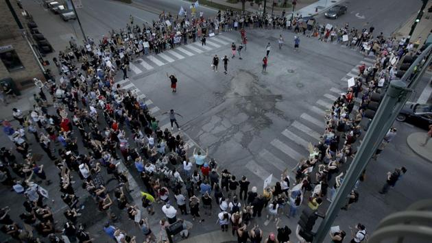 Demonstrators block an intersection as they march through the Country Club Plaza district in Kansas City, Missouri on June 13 while protesting against the death of George Floyd. The death of George Floyd has sparked protests in all 50 states of the United States and is dozens of countries around the worked. (Charlie Riedel / AP) Demonstrators block an intersection as they march through the Country Club Plaza district in Kansas City, Missouri on June 13 while protesting against the death of George Floyd. The death of George Floyd has sparked protests in all 50 states of the United States and is dozens of countries around the worked. (Charlie Riedel / AP)