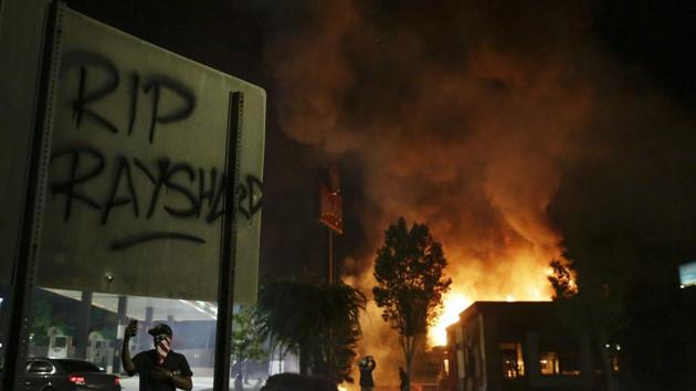 Flames engulf a Wendy's restaurant during protests on Saturday, in Atlanta. The restaurant is where Rayshard Brooks was shot and killed by police on Friday evening. (AP Photo) Flames engulf a Wendy's restaurant during protests on Saturday, in Atlanta. The restaurant is where Rayshard Brooks was shot and killed by police on Friday evening. (AP Photo)