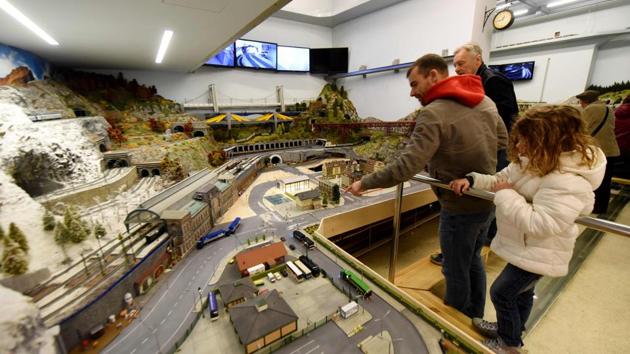Visitors look at a model trains layout at the Backo Mini Express Museum in Zagreb. More than 2,500 figurines including mountaineers, wedding guests, police, construction workers and commuters populate the scenes at the museum. (Denis Lovrovic / AFP) Visitors look at a model trains layout at the Backo Mini Express Museum in Zagreb. More than 2,500 figurines including mountaineers, wedding guests, police, construction workers and commuters populate the scenes at the museum. (Denis Lovrovic / AFP)