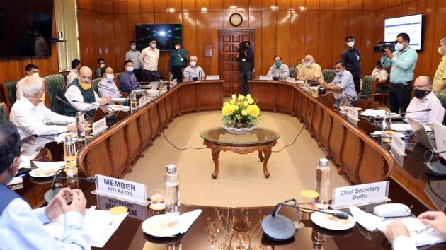 Home Minister Amit Shah (L) chairs a review meeting with Delhi CM Arvind Kejriwal and LG Anil Baijal on June 14. “To prevent the coronavirus infection in Delhi, testing will be doubled in the next two days, and after six days, testing will be increased to three times,” Shah tweeted in Hindi after the first meeting. Testing will also be done at polling stations in containment zones. (HT Photo) Home Minister Amit Shah (L) chairs a review meeting with Delhi CM Arvind Kejriwal and LG Anil Baijal on June 14. “To prevent the coronavirus infection in Delhi, testing will be doubled in the next two days, and after six days, testing will be increased to three times,” Shah tweeted in Hindi after the first meeting. Testing will also be done at polling stations in containment zones. (HT Photo)