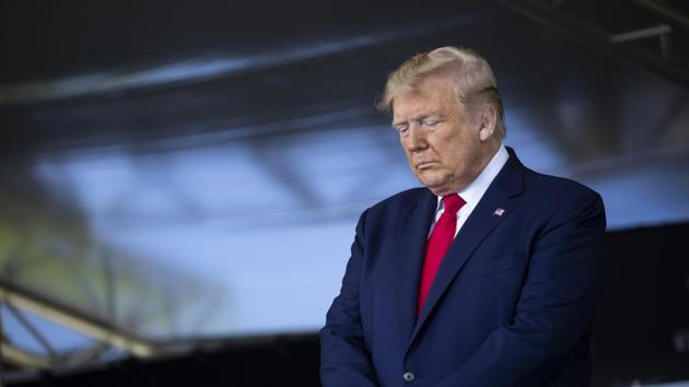 President Donald Trump bows his head in prayer before speaking to over 1,110 cadets in the Class of 2020 at a commencement ceremony on the parade field, at the United States Military Academy in West Point. (AP) President Donald Trump bows his head in prayer before speaking to over 1,110 cadets in the Class of 2020 at a commencement ceremony on the parade field, at the United States Military Academy in West Point. (AP)