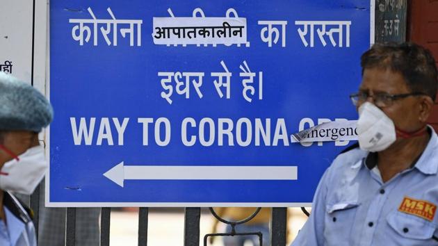 Security guards at the entrance of the Lok Nayak Jai Prakash (LNJP) hospital in New Delhi on June 11. Shah also asked private hospitals to earmark 60% of beds allotted for Covid-19 patients at a cheaper rate, a move that comes against the backdrop of allegations that such health facilities were charging patients exorbitant fees. (Sajjad Hussain / AFP) Security guards at the entrance of the Lok Nayak Jai Prakash (LNJP) hospital in New Delhi on June 11. Shah also asked private hospitals to earmark 60% of beds allotted for Covid-19 patients at a cheaper rate, a move that comes against the backdrop of allegations that such health facilities were charging patients exorbitant fees. (Sajjad Hussain / AFP)