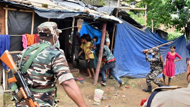 Police personnel baton charge on protestors during a protest over the murder of 26-year-old Rituparna Pegu in Guwahati. (PTI) Police personnel baton charge on protestors during a protest over the murder of 26-year-old Rituparna Pegu in Guwahati. (PTI)