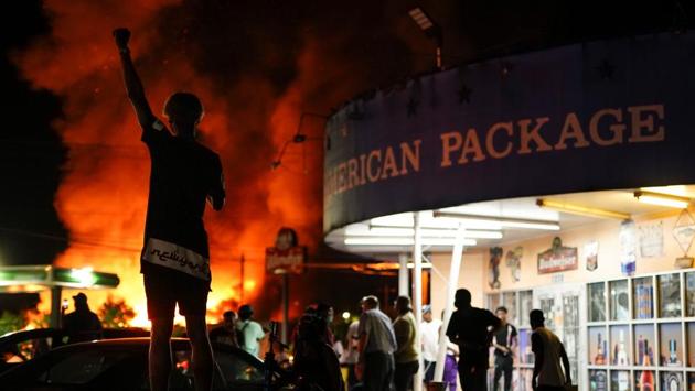 A protester watches as a Wendy’s restaurant outlet burns following a rally against racial inequality and the police shooting death of Rayshard Brooks in Atlanta, Georgia on June 13. Brooks’ death after he was shot in the drive-through restaurant’s parking lot during an arrest on June 12 has injected fresh anger into the nationwide protests. (Elijah Nouvelage / REUTERS) A protester watches as a Wendy’s restaurant outlet burns following a rally against racial inequality and the police shooting death of Rayshard Brooks in Atlanta, Georgia on June 13. Brooks’ death after he was shot in the drive-through restaurant’s parking lot during an arrest on June 12 has injected fresh anger into the nationwide protests. (Elijah Nouvelage / REUTERS)