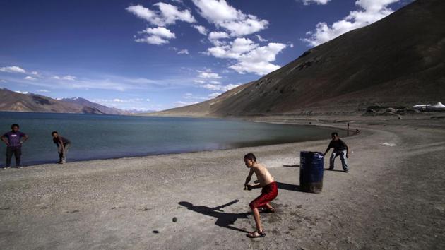 In this July 22, 2011, file photo, children play cricket by Pangong Lake, near the India-China border in Ladakh, India.(AP)