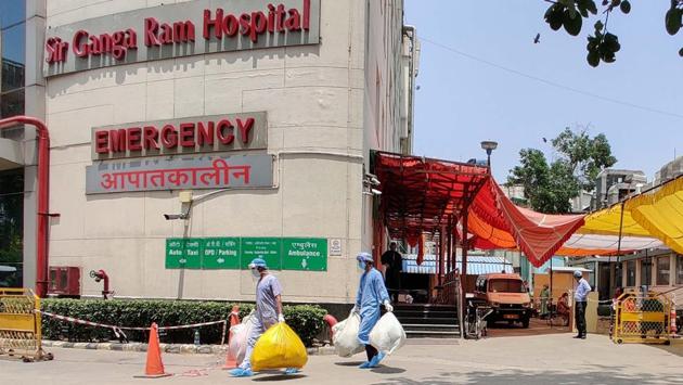 Health workers wearing PPE coveralls seen outside the Covid-19 ward at Sir Ganga Ram Hospital on Jun 12. Based on decisions taken in the review meetings, the Union ministry of health announced yesterday evening that it has set up three teams of four doctors each to inspect all major dedicated Covid-19 facilities in the state and suggest improvements. (Sanchit Khanna / HT Photo) Health workers wearing PPE coveralls seen outside the Covid-19 ward at Sir Ganga Ram Hospital on Jun 12. Based on decisions taken in the review meetings, the Union ministry of health announced yesterday evening that it has set up three teams of four doctors each to inspect all major dedicated Covid-19 facilities in the state and suggest improvements. (Sanchit Khanna / HT Photo)