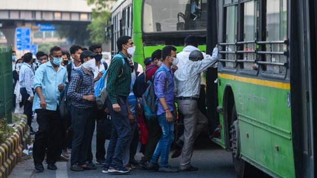 People flout social distancing norms as they rush to board a bus at INA on June 12. Delhi’s daily case load is rising and the city recorded 2,224 new coronavirus cases on June 14, making it the third consecutive day it saw more than 2,000 new infections. The national capital has registered over 41,000 cases as of June 15 according to the Covid19india.org dashboard. (Amal KS / HT Photo) People flout social distancing norms as they rush to board a bus at INA on June 12. Delhi’s daily case load is rising and the city recorded 2,224 new coronavirus cases on June 14, making it the third consecutive day it saw more than 2,000 new infections. The national capital has registered over 41,000 cases as of June 15 according to the Covid19india.org dashboard. (Amal KS / HT Photo)