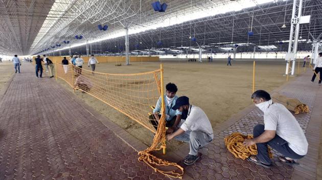 Volunteers at the Radha Soami Satsang Beas’s Bhati Mines centre set up a 10,000 bed facility for Covid-19 patients in New Delhi on June 14. A focal point of Delhi’s Covid-19 strategy has been healthcare infrastructure. The Delhi government has zeroed in on 77 banquet halls and 40 hotels to add nearly 16,000 beds to the existing capacity of 9,698 beds in the city. (Sanjeev Verma / HT Photo) Volunteers at the Radha Soami Satsang Beas’s Bhati Mines centre set up a 10,000 bed facility for Covid-19 patients in New Delhi on June 14. A focal point of Delhi’s Covid-19 strategy has been healthcare infrastructure. The Delhi government has zeroed in on 77 banquet halls and 40 hotels to add nearly 16,000 beds to the existing capacity of 9,698 beds in the city. (Sanjeev Verma / HT Photo)