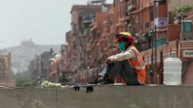 A construction worker takes a break at an underground metro rail site. The Delhi government had in April said it will disburse Rs 5,000 to all registered construction workers in the city.(Photo by Himanshu Vyas/ Hindustan Times) A construction worker takes a break at an underground metro rail site. The Delhi government had in April said it will disburse Rs 5,000 to all registered construction workers in the city.(Photo by Himanshu Vyas/ Hindustan Times)