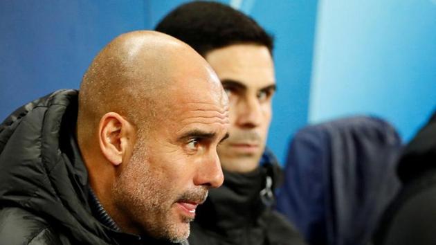 FILE PHOTO: Soccer Football - Champions League - Group C - Manchester City v Shakhtar Donetsk - Etihad Stadium, Manchester, Britain - November 26, 2019 Manchester City manager Pep Guardiola and assistant coach Mikel Arteta before the match Action Images via Reuters/Jason Cairnduff/File Photo (Action Images via Reuters) FILE PHOTO: Soccer Football - Champions League - Group C - Manchester City v Shakhtar Donetsk - Etihad Stadium, Manchester, Britain - November 26, 2019 Manchester City manager Pep Guardiola and assistant coach Mikel Arteta before the match Action Images via Reuters/Jason Cairnduff/File Photo (Action Images via Reuters)