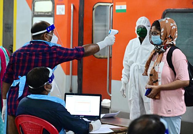 A passenger being tested with Thermal check after arriving at Thiruvananthapuram railway station.(ANI)