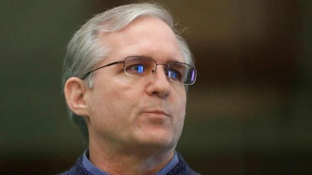 Former US Marine Paul Whelan, who was detained and accused of espionage, stands inside a defendants' cage during his verdict hearing in Moscow, Russia on June 15, 2020.(REUTERS)