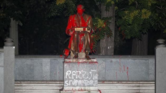 A statue of Indro Montanelli, a one-time fascist who became and icon of Italy's right and a leading name in Italian journalism, is covered with red paint during a Black Lives Matter protest, in Milan, Italy, Saturday, June 13, 2020. Protesters want to remove the statue. White paint on the statue reads: "Racist and rapist." (AP Photo/Antonio Calanni)(AP) A statue of Indro Montanelli, a one-time fascist who became and icon of Italy's right and a leading name in Italian journalism, is covered with red paint during a Black Lives Matter protest, in Milan, Italy, Saturday, June 13, 2020. Protesters want to remove the statue. White paint on the statue reads: "Racist and rapist." (AP Photo/Antonio Calanni)(AP)
