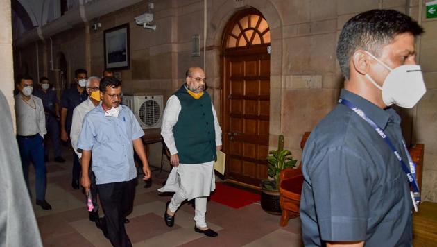 Union Home Minister Amit Shah, Union Home Secretary Ajay Kumar Bhalla and Delhi CM Arvind Kejriwal arrive for a meeting on the COVID-19 situation in the national capital, during the ongoing nationwide lockdown, in New Delhi. (PTI) Union Home Minister Amit Shah, Union Home Secretary Ajay Kumar Bhalla and Delhi CM Arvind Kejriwal arrive for a meeting on the COVID-19 situation in the national capital, during the ongoing nationwide lockdown, in New Delhi. (PTI)