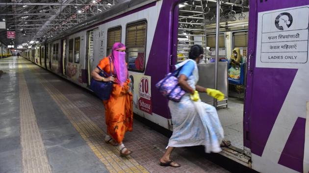 Essential service workers board a women’s compartment on a local train at CSMT on June 15. A total of 700 passengers were allowed on board each train, with approximately 58 passengers inside each compartment. Distancing norms were observed and passengers were screened before boarding trains. (Anshuman Poyrekar / HT Photo) Essential service workers board a women’s compartment on a local train at CSMT on June 15. A total of 700 passengers were allowed on board each train, with approximately 58 passengers inside each compartment. Distancing norms were observed and passengers were screened before boarding trains. (Anshuman Poyrekar / HT Photo)