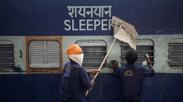 Workers clean a train coach that has been converted into an isolation ward for coronavirus patients at Anand Vihar Railway Station in New Delhi. (Biplov Bhuyan/HT PHOTO) Workers clean a train coach that has been converted into an isolation ward for coronavirus patients at Anand Vihar Railway Station in New Delhi. (Biplov Bhuyan/HT PHOTO)