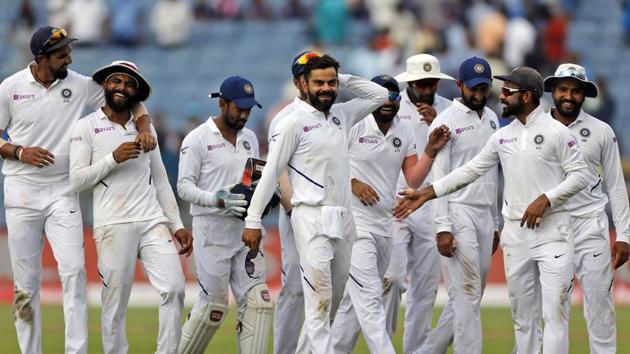 India's cricket team captain Virat Kohli, center, celebrates with teammates after winning the second cricket test match against South Africa in Pune, India, Sunday, Oct. 13, 2019. (AP Photo/Rajanish Kakade)(AP)