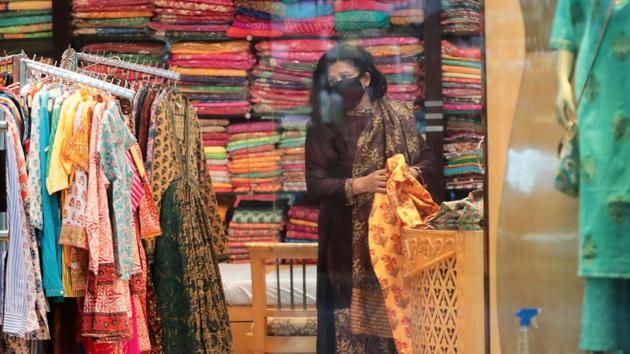 A woman shopping at a clothing store in a mall in Jaipur, Rajasthan. (Hemant Vyas /HT Photo) A woman shopping at a clothing store in a mall in Jaipur, Rajasthan. (Hemant Vyas /HT Photo)