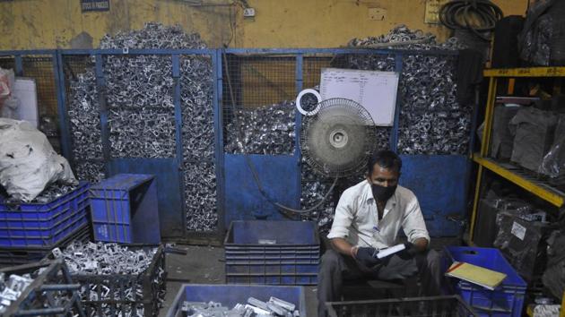 An employee seen at work at an aluminum die-casting manufacturer company in sector 57, Noida. (Photo by Sunil Ghosh / Hindustan Times)