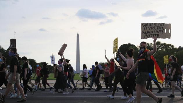 Demonstrators walk in a protest calling to defund the police in the aftermath of the death in Minneapolis police custody of George Floyd, in Washington. (REUTERS) Demonstrators walk in a protest calling to defund the police in the aftermath of the death in Minneapolis police custody of George Floyd, in Washington. (REUTERS)