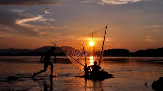A fisherman fishing on the banks of river Brahmaputra during the sunset in Guwahati on Monday. Induced seismicity refers to tremors and earthquakes, mostly of low magnitude, which are caused by human activity including oil and gas operations. (ANI) A fisherman fishing on the banks of river Brahmaputra during the sunset in Guwahati on Monday. Induced seismicity refers to tremors and earthquakes, mostly of low magnitude, which are caused by human activity including oil and gas operations. (ANI)