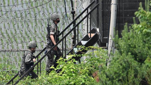 South Korean soldiers walk up the stairs of a guard post in a sideline of Imjingak peace park in the border city of Paju on June 16. North Korea’s army is “fully ready” to take action against the South, state media said on June 16 in the latest verbal sabre-rattling from Pyongyang. (Jung Yeon-je / AFP)