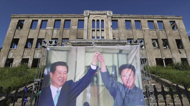 A banner showing an image of late South Korean President Kim Dae-jung (L) and North Korean leader Kim Jong Il is displayed to mark the 20th anniversary of the June 2000 inter-Korean summit and joint peace declaration, near the demilitarized zone in Cheorwon, South Korea on June 15. North Korea has blown an inter-Korean liaison office on its side of the border a day later, after days of hostile rhetoric from Pyongyang. (Yang Ji-ung / Yonhap via AP)