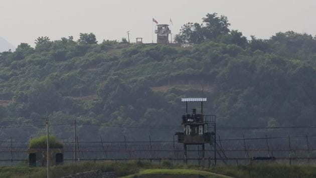 North Korean (rear) and South Korean (foreground) guard posts in Paju, the border between the two countries on June 16. Pyongyang’s official Korean Central News Agency said today the office’s destruction was in line with “the mindset of the enraged people to surely force human scum and those who have sheltered the scum to pay dearly for their crimes.” (Ahn Young-joon / AP)