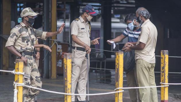 Security personnel screen people to verify if they belong to essential services as identified by the state government, outside Andheri station on June 15. Train services are for now being provided to BMC, Brihanmumbai Electric Supply and Transport (BEST) undertaking, Mumbai Police personnel as well as people working at Mantralaya and in city hospitals. (Pratik Chorge / HT Photo) Security personnel screen people to verify if they belong to essential services as identified by the state government, outside Andheri station on June 15. Train services are for now being provided to BMC, Brihanmumbai Electric Supply and Transport (BEST) undertaking, Mumbai Police personnel as well as people working at Mantralaya and in city hospitals. (Pratik Chorge / HT Photo)