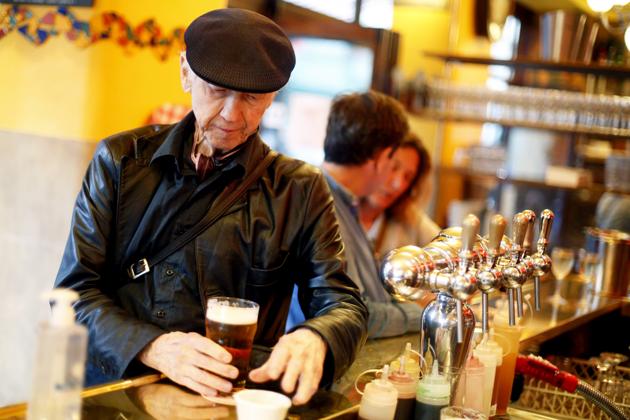 A man drinks a beer in the bar Le Marche, Monday, June 15, 2020 in Paris. Paris is rediscovering itself, as its cafes and restaurants reopen for the first time since the fast-spreading virus forced them to close their doors March 14. Restaurants outside the Paris region opened earlier this month, and Paris cafes were allowed to serve people outside but not open their doors. After three months of losses, some restaurateurs fear it will take a long time for business to come back. (AP Photo/Thibault Camus) (AP)
