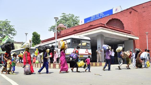 Migrant workers arrive at the Amritsar railway station to board a Shramik special train on June 14. Before lending support to fight against Covid-19 through isolation ward coaches, the railways had resumed services partially and ferried over 60 lakh migrant workers home via 4,450 Shramik trains starting May 1. (Sameer Sehgal / HT Photo) Migrant workers arrive at the Amritsar railway station to board a Shramik special train on June 14. Before lending support to fight against Covid-19 through isolation ward coaches, the railways had resumed services partially and ferried over 60 lakh migrant workers home via 4,450 Shramik trains starting May 1. (Sameer Sehgal / HT Photo)