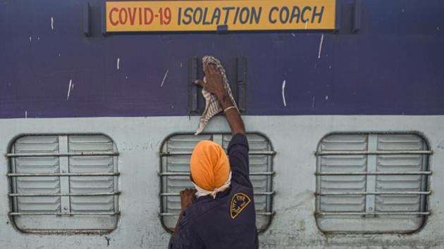 A railways employee cleans a train coach readied for use as a temporary isolation ward for coronavirus patients at Anand Vihar railway station on June 16. In light of surging cases in the capital, Home Minister Amit Shah ordered 250 COVID-19 care coaches deployed by June 16. (Biplov Bhuyan / HT Photo) A railways employee cleans a train coach readied for use as a temporary isolation ward for coronavirus patients at Anand Vihar railway station on June 16. In light of surging cases in the capital, Home Minister Amit Shah ordered 250 COVID-19 care coaches deployed by June 16. (Biplov Bhuyan / HT Photo)