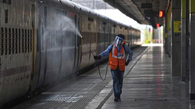 A worker sanitizes the outside of a train coach readied for use as a temporary isolation ward on June 16. The Chairman of the Railway Board also told PTI that suspected and confirmed patients would be kept in separate coaches. (Biplov Bhuyan / HT Photo) A worker sanitizes the outside of a train coach readied for use as a temporary isolation ward on June 16. The Chairman of the Railway Board also told PTI that suspected and confirmed patients would be kept in separate coaches. (Biplov Bhuyan / HT Photo)