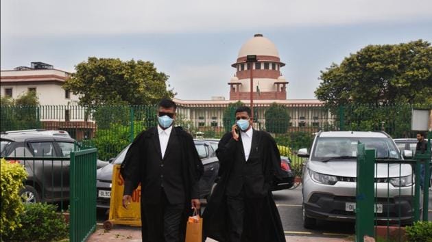 Advocates wearing protective masks as a precautionary measure amid rising coronavirus scare, at Supreme Court area, Bhagwan Dass road, in New Delhi.(Raj K Raj/HT PHOTO)