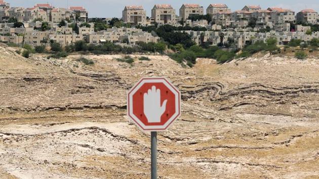 A traffic sign is pictured in front of the Israeli settlement of Maale Adumim in the Israeli-occupied West Bank. (REUTERS) A traffic sign is pictured in front of the Israeli settlement of Maale Adumim in the Israeli-occupied West Bank. (REUTERS)