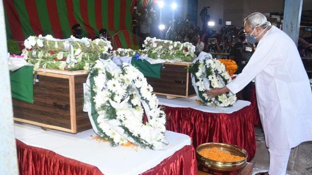 Odisha Chief Minister Naveen Patnaik paying his respects to two soldiers of 16 Bihar Regiment who were killed in Ladakh’s Galwan Valley Monday night in a clash with Chinese troops.(HT PHOTO)