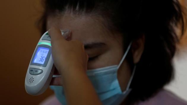 Maria Bravo gets her temperature measured before attending the daily workshops at the Alas Foundation centre for women with intellectual disabilities amid the COVID-19 outbreak in Madrid, Spain, June 16, 2020. (REUTERS) Maria Bravo gets her temperature measured before attending the daily workshops at the Alas Foundation centre for women with intellectual disabilities amid the COVID-19 outbreak in Madrid, Spain, June 16, 2020. (REUTERS)