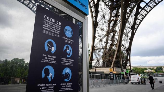Sanitary instructions are displayed in the waiting area up the Eiffel Tower on June 15. Managers told Reuters they hope to get operations fully back to normal later in the summer. In the meantime, a series of safety measures will be in place and only limited numbers of people will be allowed in initially. (Bertrand Guay / AFP) 