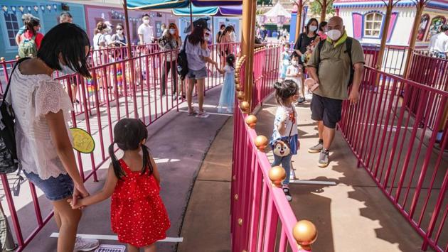 Visitors observe social distancing measures while queuing to board the ‘Dumbo the Flying Elephant’ ride at Disneyland Resort in Hong Kong. In contrast to major outbreaks seen in other big cities around the world, Hong Kong has reported a relatively small number of infections, recording 1,121 cases and four deaths. (Lam Yik / Bloomberg) Visitors observe social distancing measures while queuing to board the ‘Dumbo the Flying Elephant’ ride at Disneyland Resort in Hong Kong. In contrast to major outbreaks seen in other big cities around the world, Hong Kong has reported a relatively small number of infections, recording 1,121 cases and four deaths. (Lam Yik / Bloomberg)