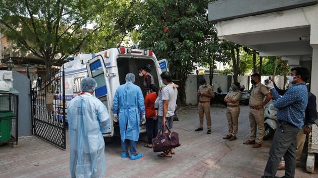 A family is transported to a quarantine centre after one of the members tested positive for the coronavirus disease (COVID-19), in Ahmedabad. (REUTERS) A family is transported to a quarantine centre after one of the members tested positive for the coronavirus disease (COVID-19), in Ahmedabad. (REUTERS)