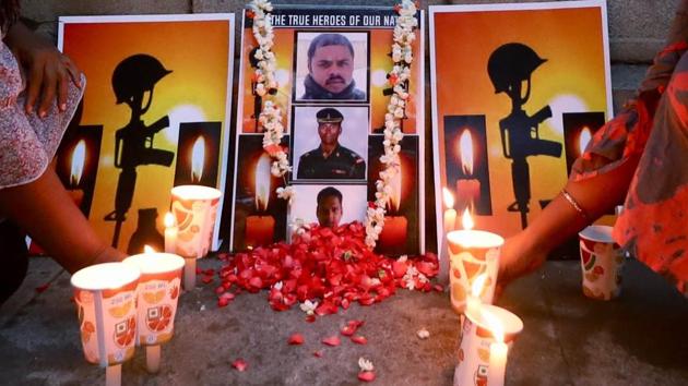 People light candles as they pay tribute to Indian soldiers who lost their lives in Galwan Valley clash. (ANI) People light candles as they pay tribute to Indian soldiers who lost their lives in Galwan Valley clash. (ANI)