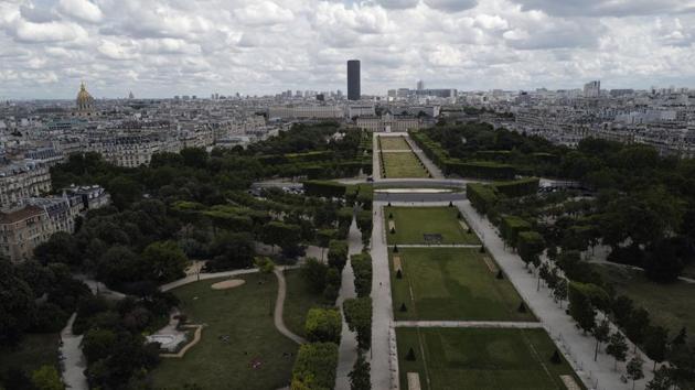 A view of the Champ de Mars with the Montparnasse tower, and the Invalides Museum dome (L), pictured from the first floor at the Eiffel Tower on June 16. Once up, the views remain as spectacular as ever and with far smaller crowds expected to jostle for space this season. (Francois Mori / AP) 